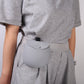Silicone dog treat pouch clipped to a waistband, worn hands free on the hip