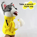 Yellow tracksuit boxing dog hand puppet worn on a hand, grey and white husky head, tongue out