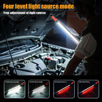 COB LED work light lighting a car engine bay, held over the open hood