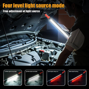 COB LED work light lighting a car engine bay, held over the open hood