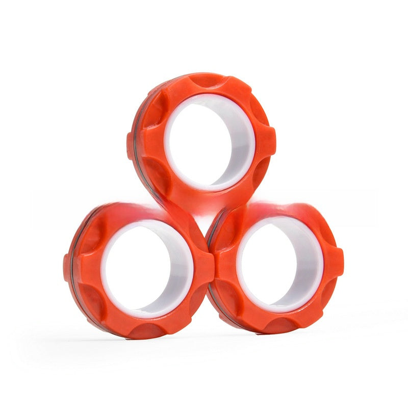 Adult using magnetic fidget rings at an office desk
