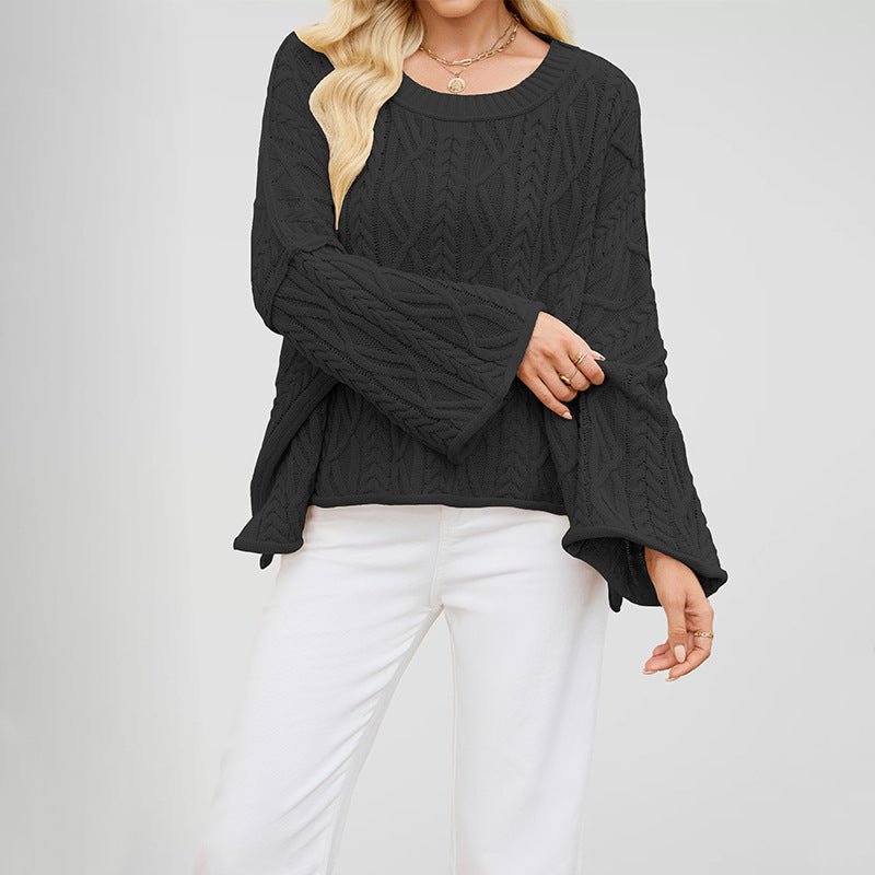 Round neck cable knit pullover with an open braided stitch and boxy relaxed body