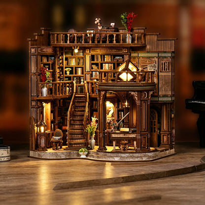 Assembled natural wood Dreamy Book Hall miniature model glowing warm amber on a wooden desk at night