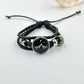 Pink braided cord bracelet with a moon charm shown adjustable with a sliding knot