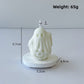 Close view of the draped ghost shape of the paraffin candle