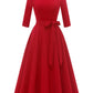 Swing dress with bow belt arranged in a gift ready presentation view