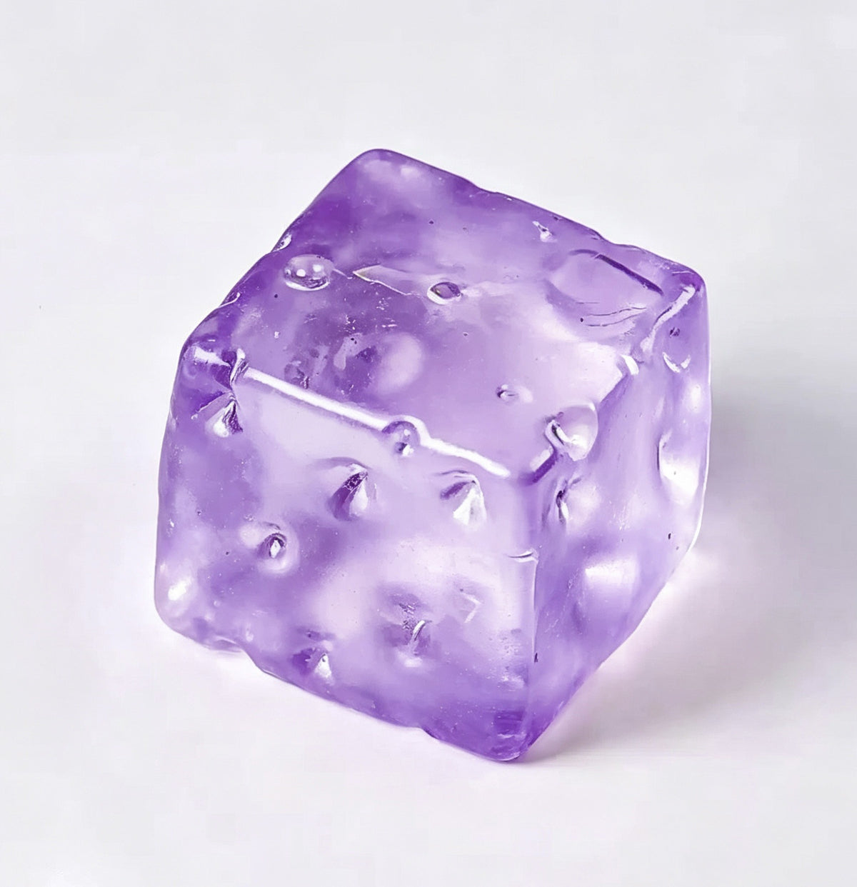 Translucent purple cheese cube squishy toy with moulded holes