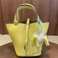 Leather bucket tote bag photographed in natural daylight