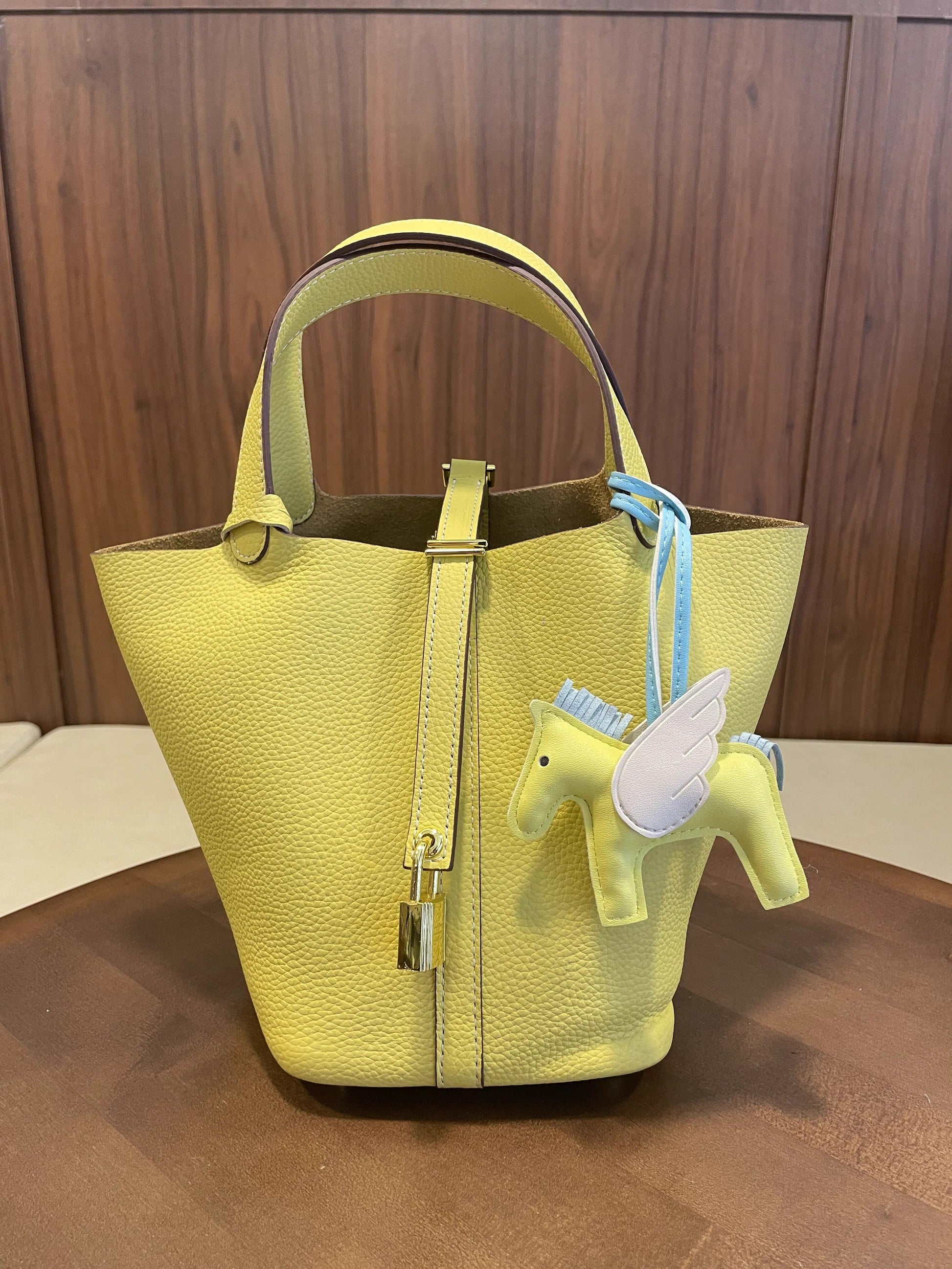 Leather bucket tote bag photographed in natural daylight