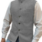 Silver herringbone stand collar vest over a white shirt, size M