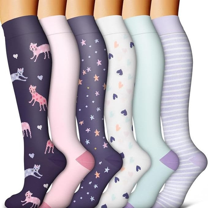 Assorted print knee high compression sport socks laid out side by side