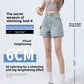 A-line denim shorts flaring to a raw frayed hem at the mid-thigh on a model
