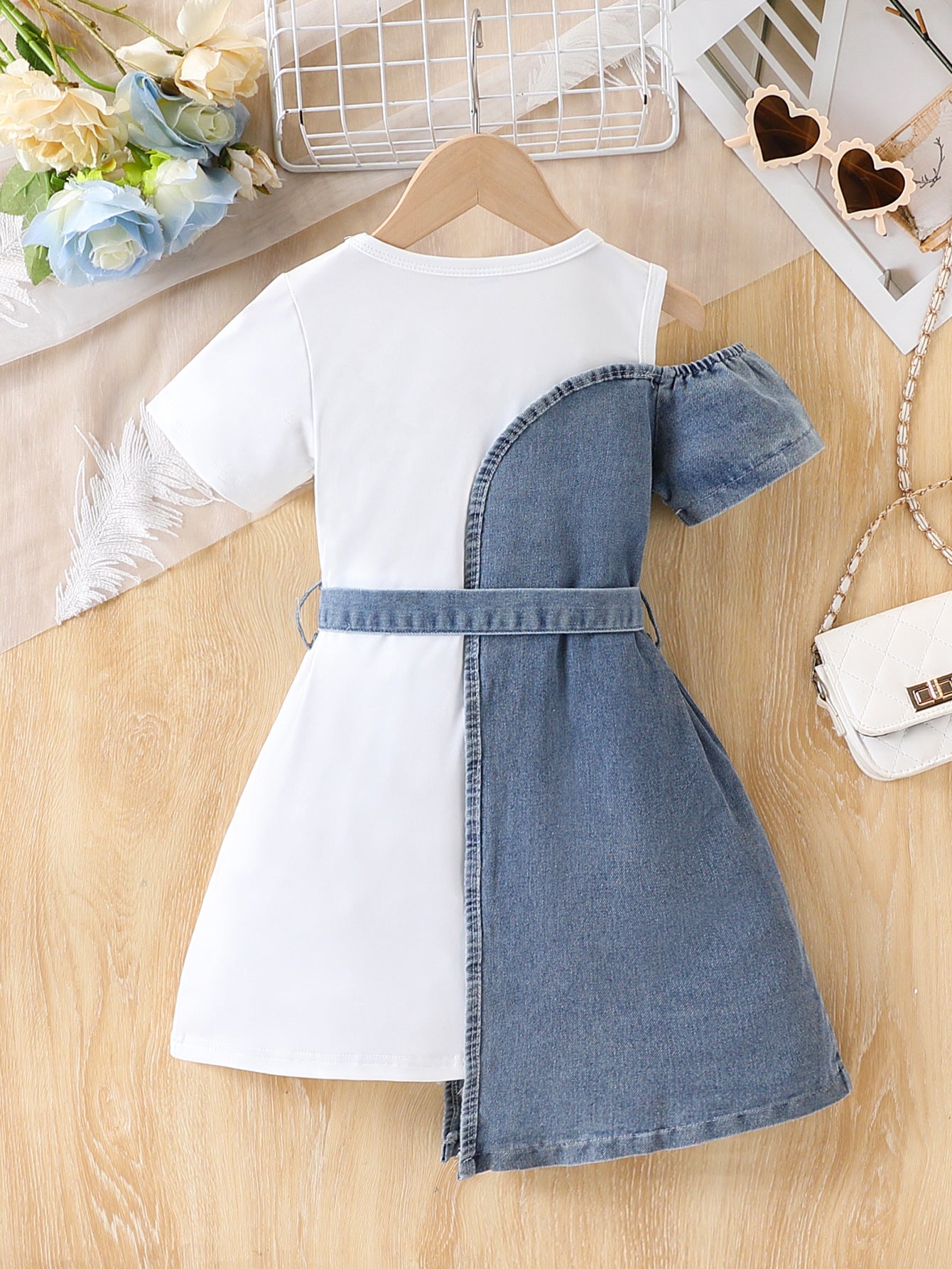 Girls' white denim dress styled with leggings and trainers
