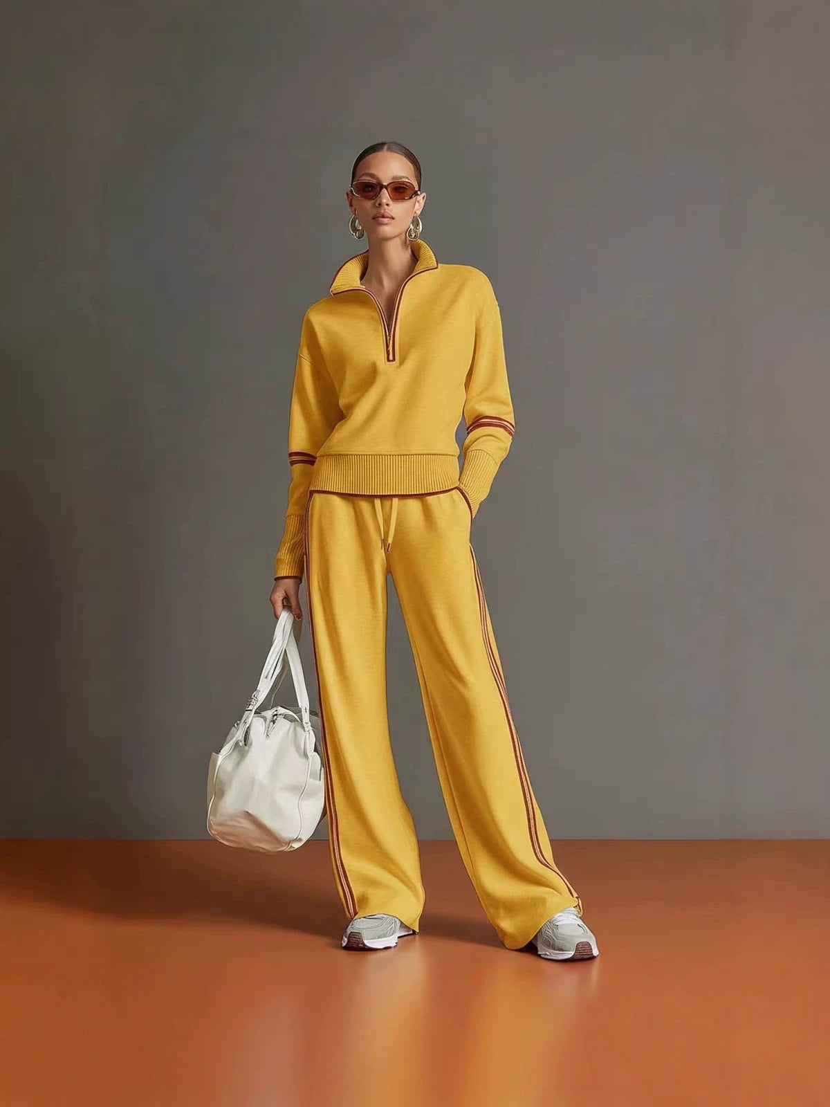 Yellow half zip sweatshirt and wide leg pants set with rust piping, worn full length