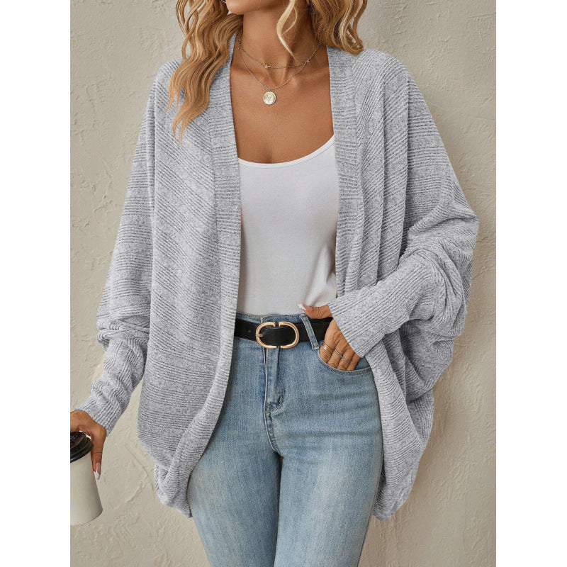 Close view of the ribbed knit on an apricot womens open front cardigan
