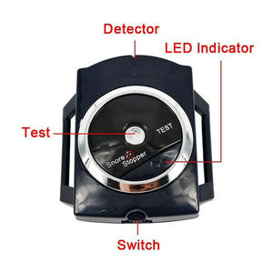 Black wrist snore sensor band with a round face and TEST button on a soft strap