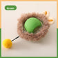 Green rolling cat ball set in a brown plush ring with embroidered ears and a yellow pompom on a wire