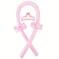 Pink heatless curling rod with claw clip and bow scrunchies on a white background