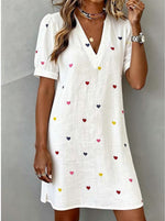 Printed dress in soft flowing fabric, front view full-length studio shot