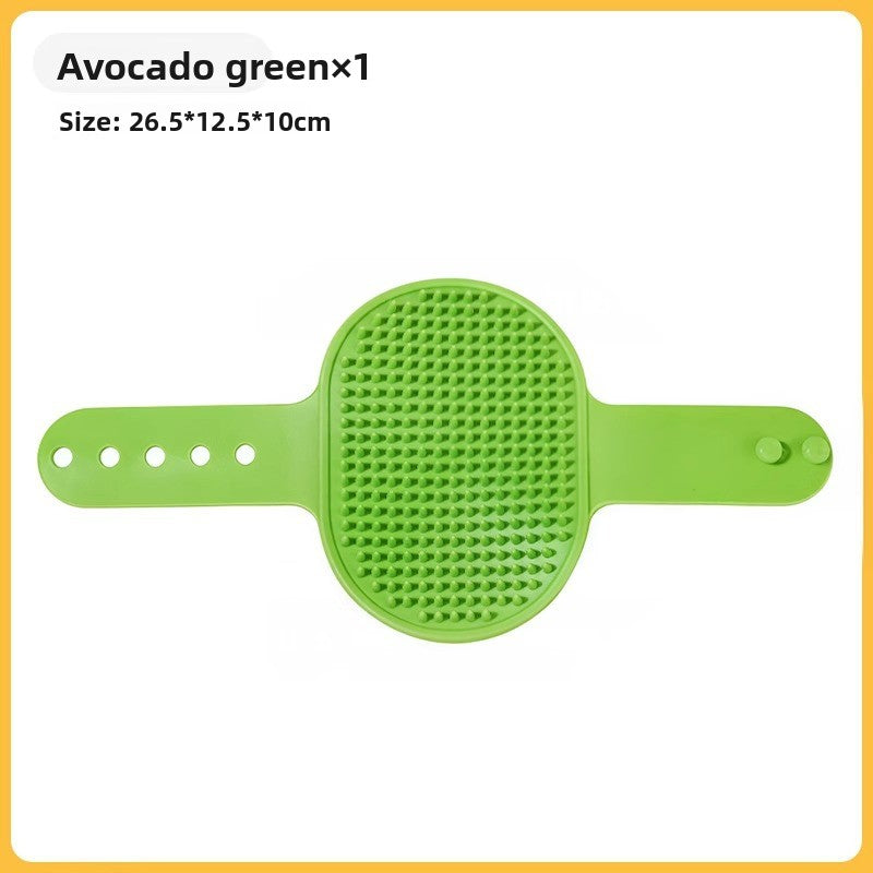 Avocado green groomer brush shown flat next to the label size 26.5 by 12.5 by 10 cm