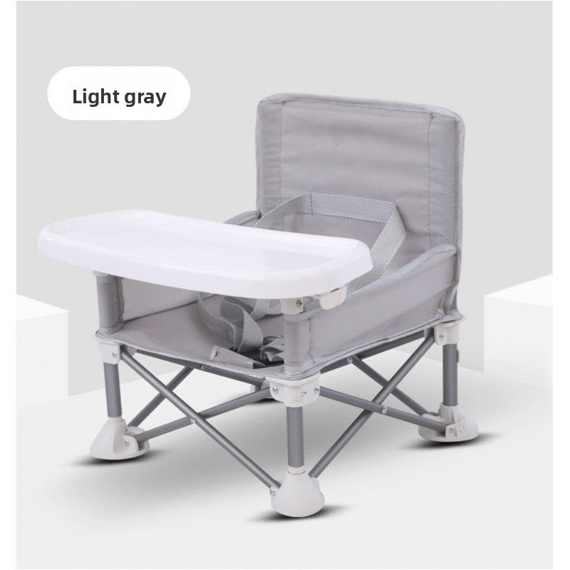 Light grey folding baby feeding chair without canopy, white tray and grey metal frame