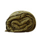 Washed pure linen duvet cover folded and rolled on a wooden surface