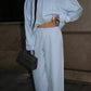 Light blue zip front hooded sweatshirt and wide leg trousers set, Sky blue color, worn by a model, the Size M option