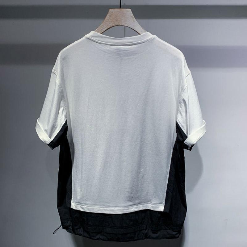 Color block panel t-shirt showing the drop shoulder cut and short cuffed sleeves