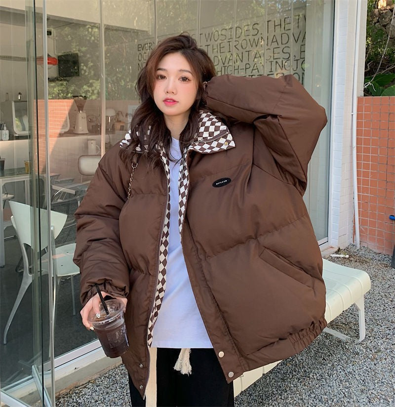 Womens short padded puffer coat, loose oversized fit with stand collar, shown in black