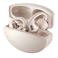 Champagne open ear clip earphones resting in their open rounded charging case