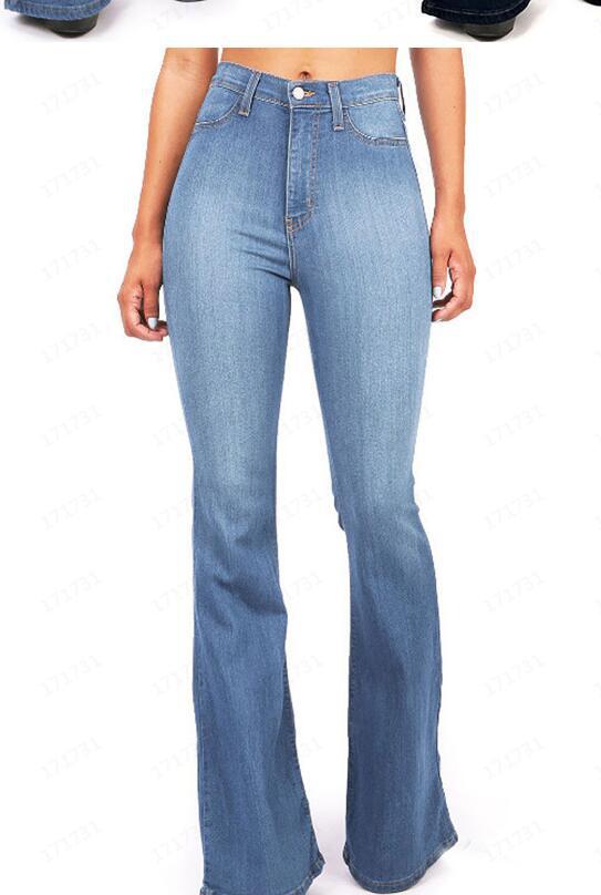 Womens high waisted bootcut jeans in light blue denim shown on a model from the waist
