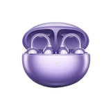 Purple open ear clip wireless earbuds resting in an open rounded charging case