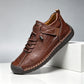 Pair of hand-stitched casual shoes with a stitched welt sole