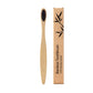 Flat bamboo handle of the toothbrush shown from the side