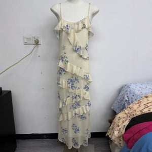 Rose print maxi dress with cascading ruffle tiers falling to a soft mermaid hem
