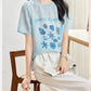 Lake Blue silk blouse seated view showing relaxed straight cut and side vent