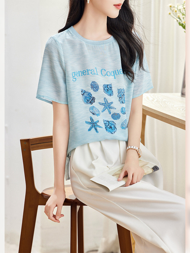 Lake Blue silk blouse seated view showing relaxed straight cut and side vent