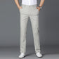 Light gray linen mens trousers straight cut shown from the front over loafers