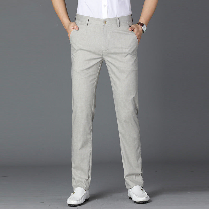 Light gray linen mens trousers straight cut shown from the front over loafers