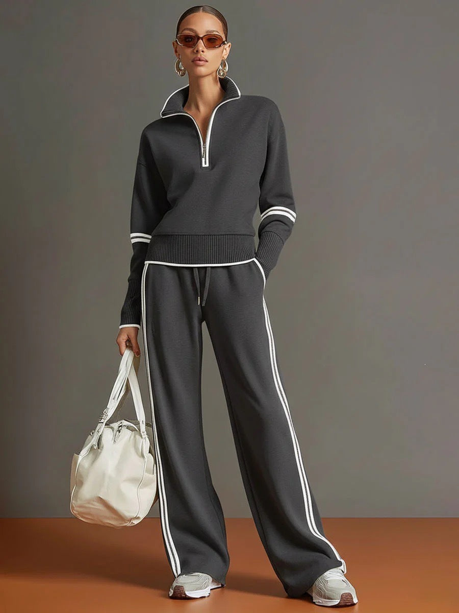 Two piece Grey sweatshirt and pants set, white piping on the collar, cuffs and side seams