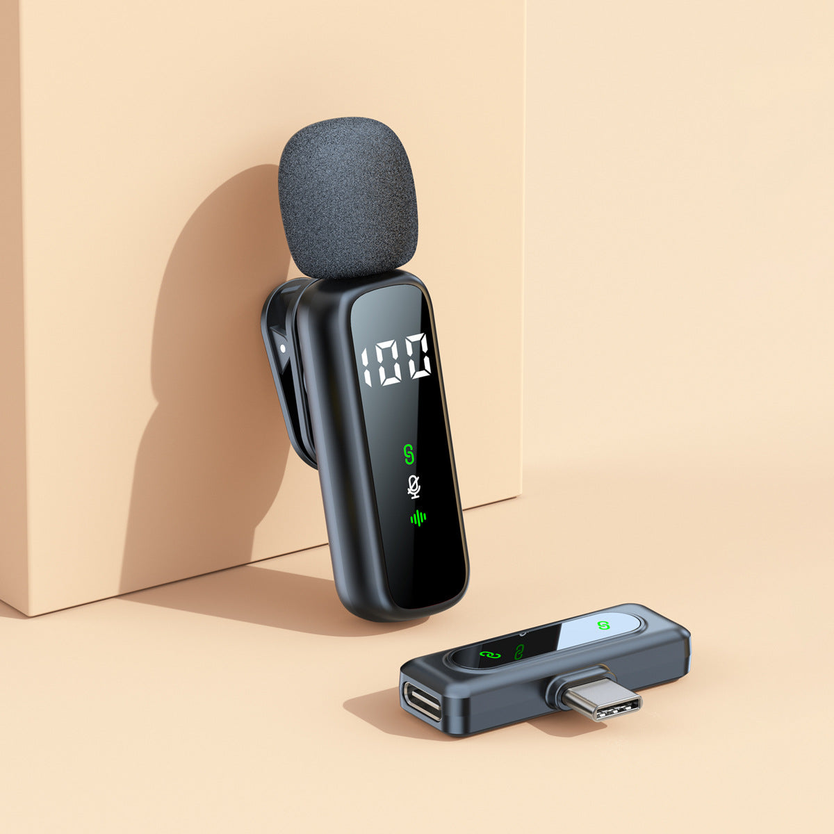 Single wireless lavalier clip mic with a USB-C receiver on a beige background