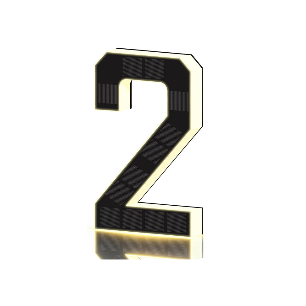 Black and gold solar LED house number sign, one character with a backlit warm outline, three quarter view