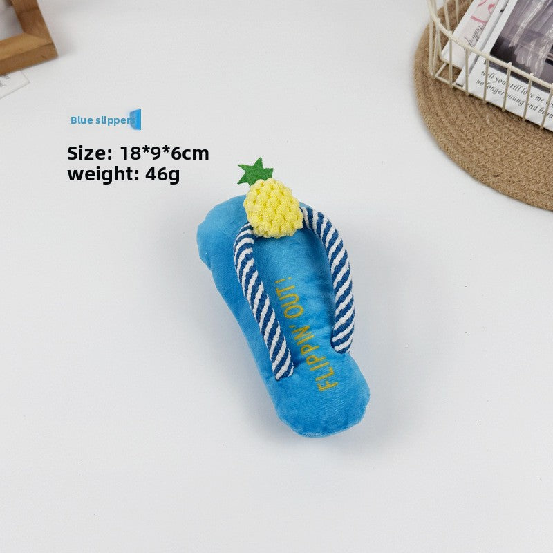 Blue plush squeaky pet toy shaped like a flip flop sandal, about 18 by 9 by 6cm on a white surface