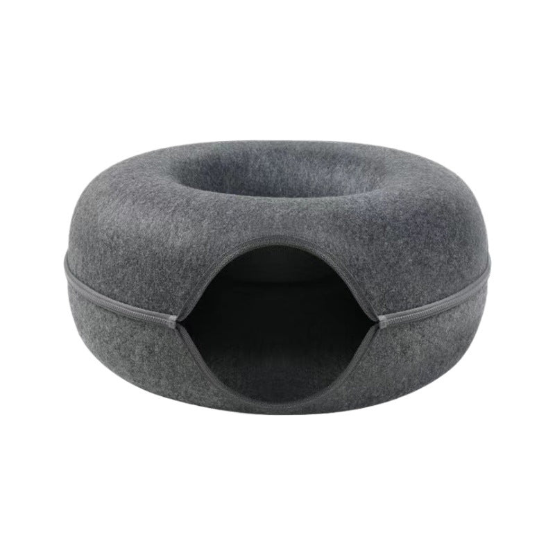 Pink felt donut cat tunnel bed shown from the front with the top nest opening visible