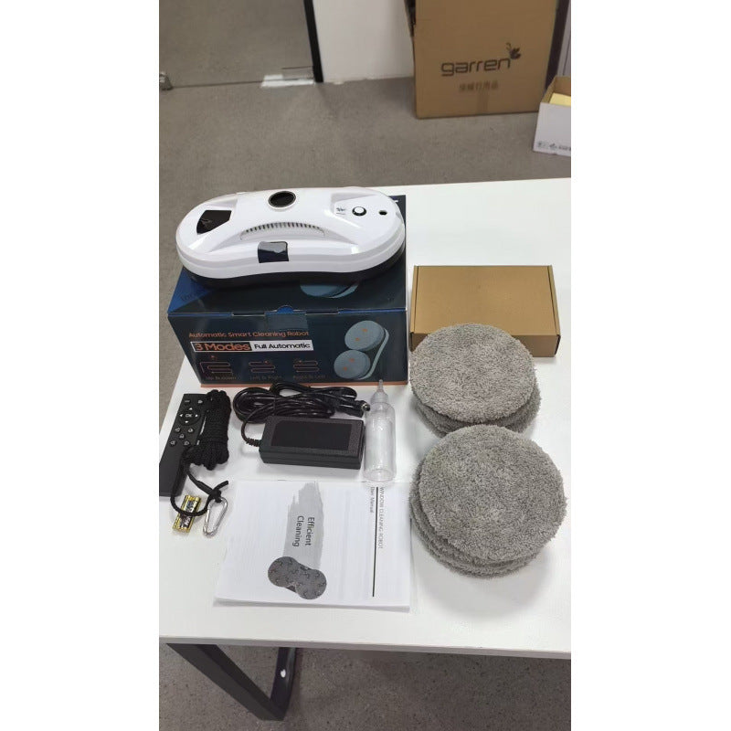 Side profile of the white figure eight window cleaning robot on glass