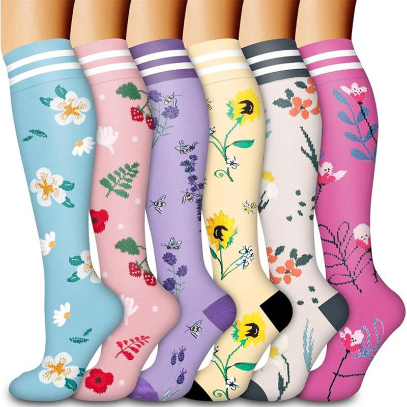 Knee high graduated compression sport socks displayed as a colour assortment