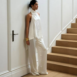 Satin halter top showing tie neckline and bare shoulders