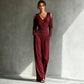 Hand resting in the side seam pocket of the wide-leg jumpsuit