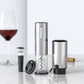 Brushed steel electric wine opener, vacuum stopper, foil cutter and aerating pourer by a wine glass