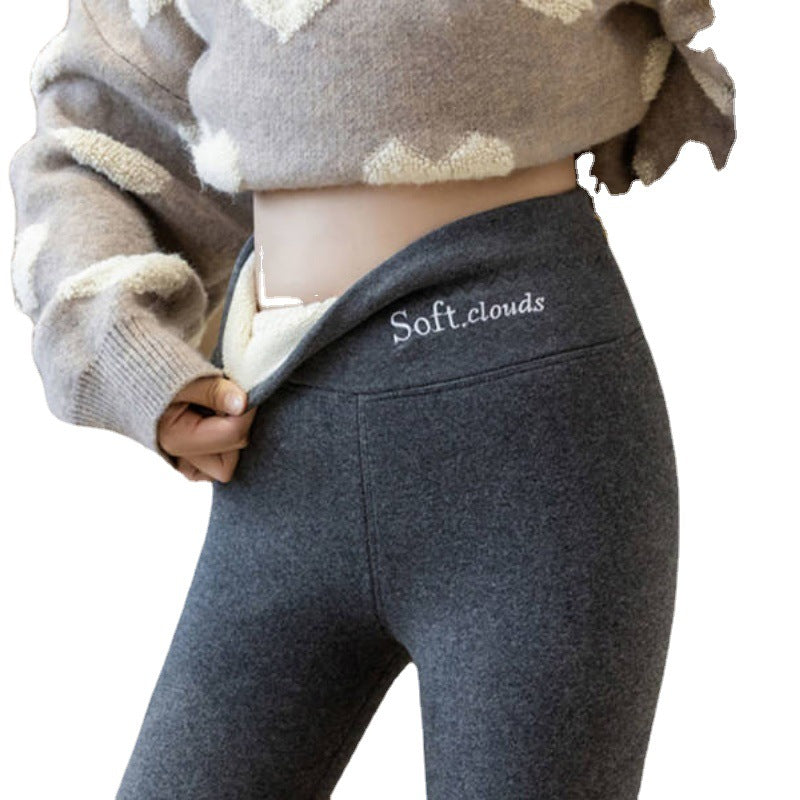 Dark gray high waist leggings on a white background with the waistband turned down over the cream lining